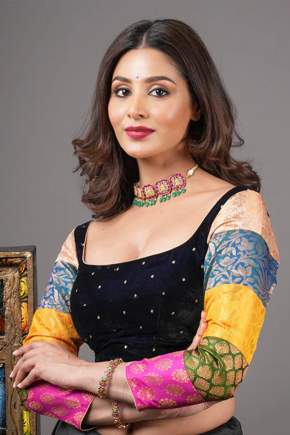 Midnight blue velvet blouse with rounded square neck and pure kanjivaram silk brocade  sleeves.
